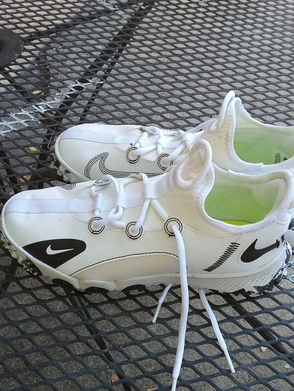 Nike White Sneakers with Black Swoosh Accents